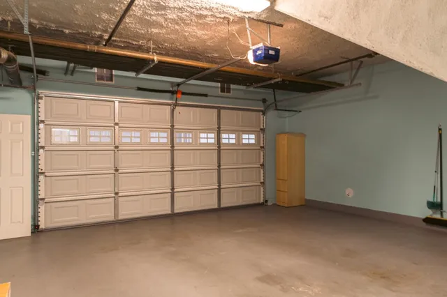 a bathroom with a toilet and a mirror