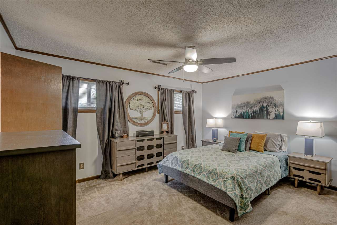 1631 Cranford Road Memphis, TN 38117 - Photo 12 of 21 a bedroom with a bed and a chandelier