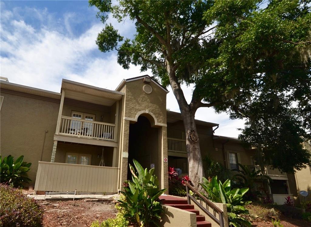 285 Wymore Road, Unit 201 Altamonte Springs, FL 32714 - Photo 1 of 1 a front view of a house with garden