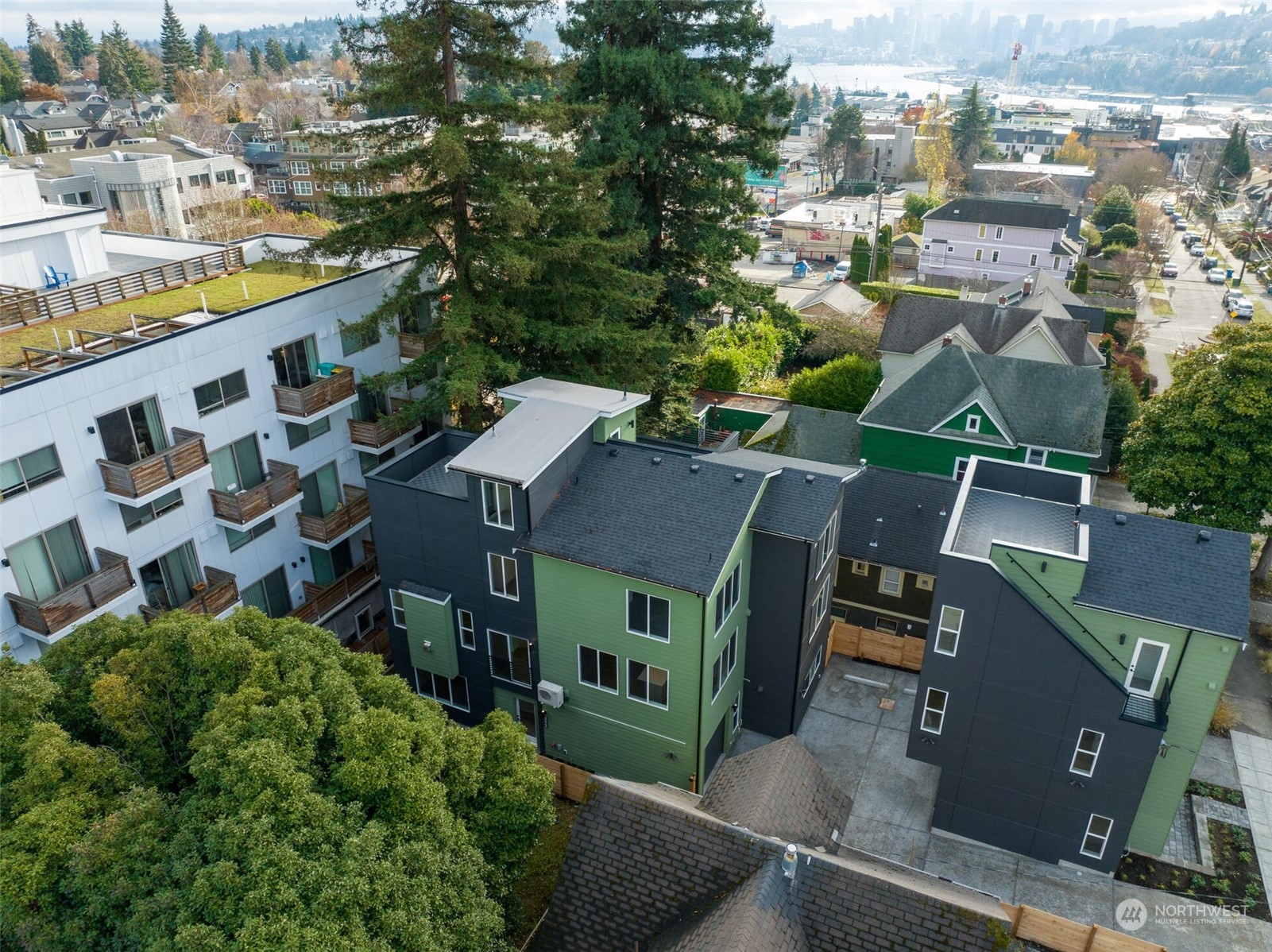 4024 Midvale Avenue North Seattle, WA 98103 - Photo 1 of 26 an aerial view of multiple houses with a yard