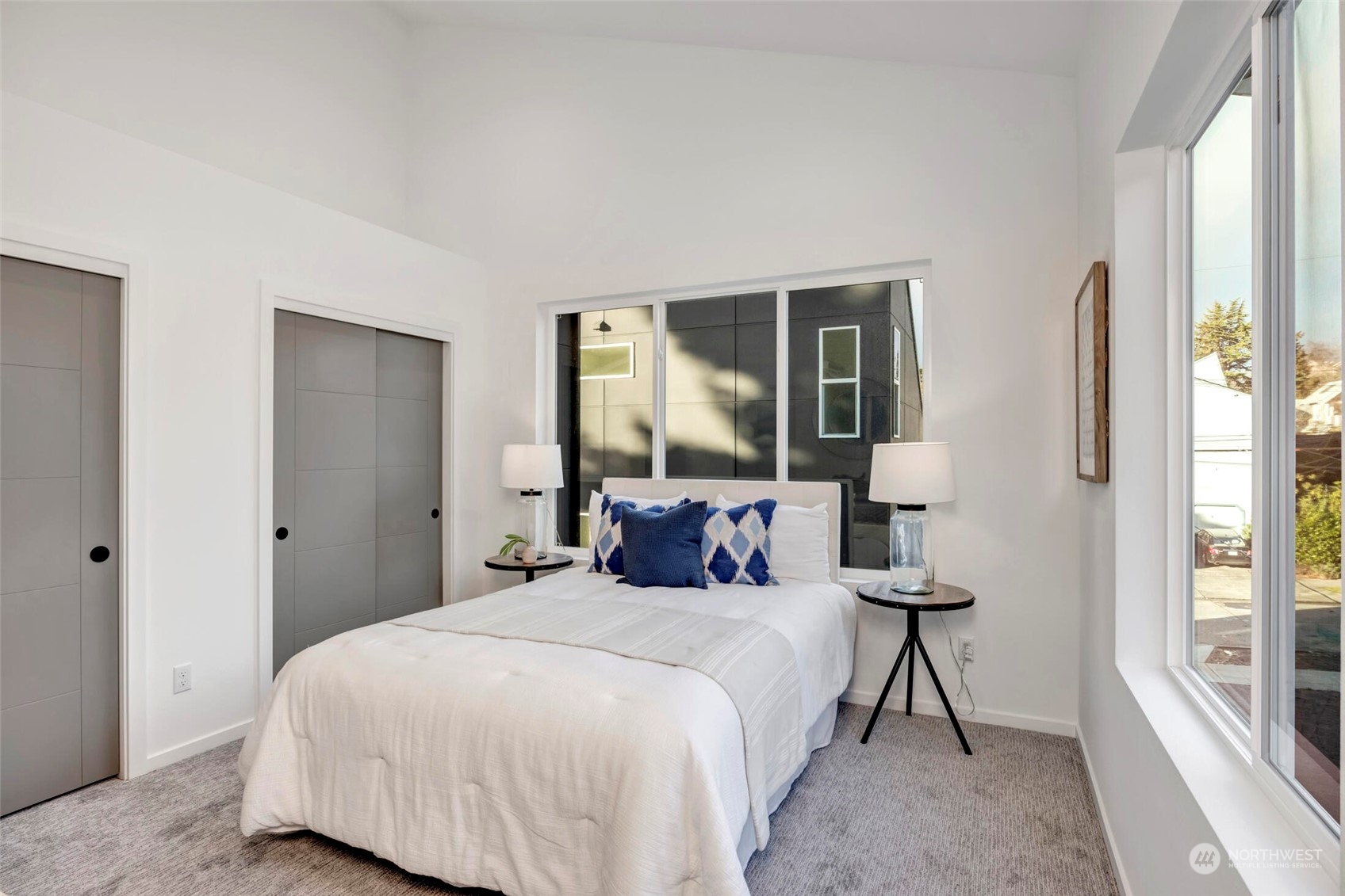 4024 Midvale Avenue North Seattle, WA 98103 - Photo 15 of 26 a bedroom with a large bed and a large window