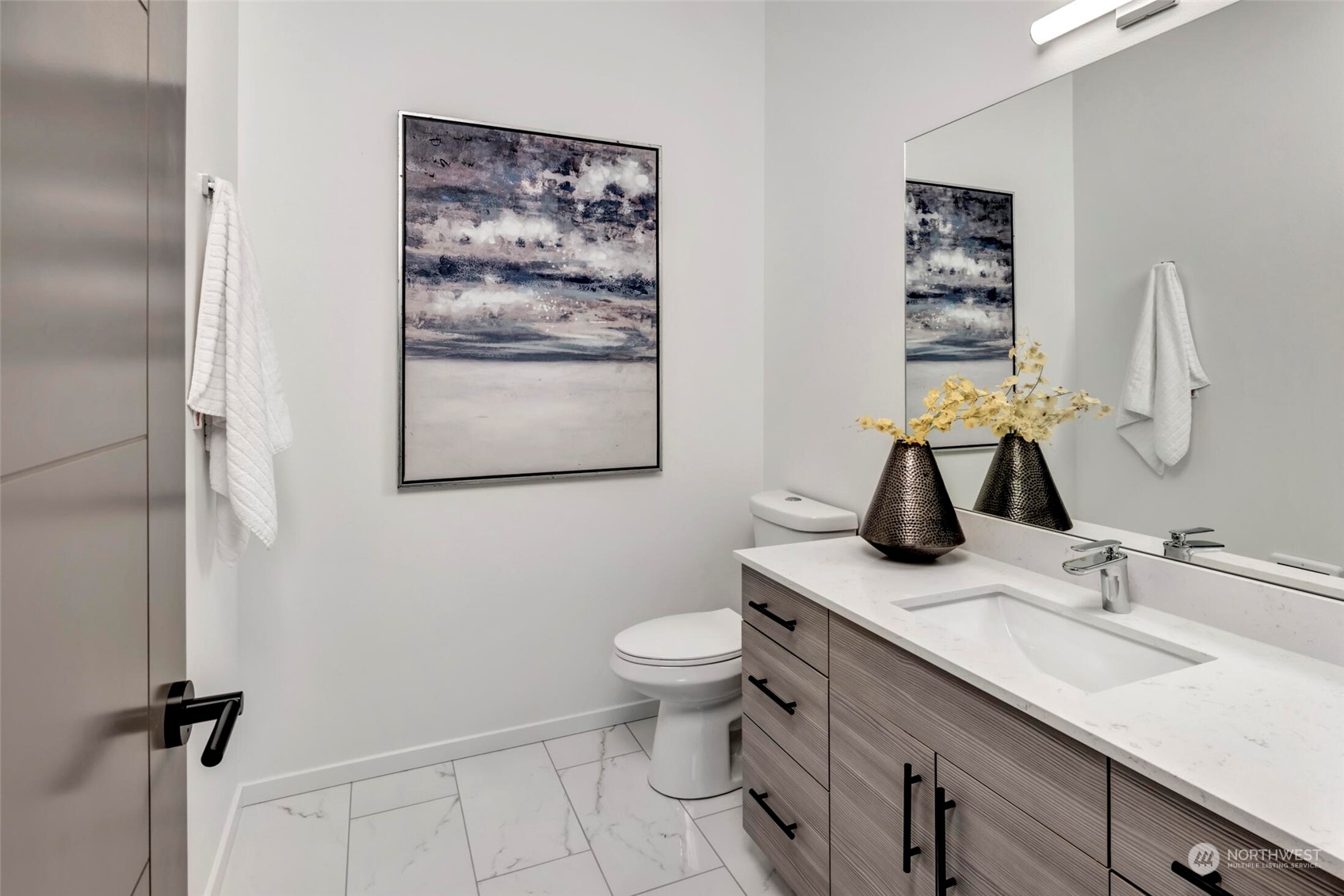 4024 Midvale Avenue North Seattle, WA 98103 - Photo 17 of 26 a bathroom with a granite countertop sink toilet and a mirror
