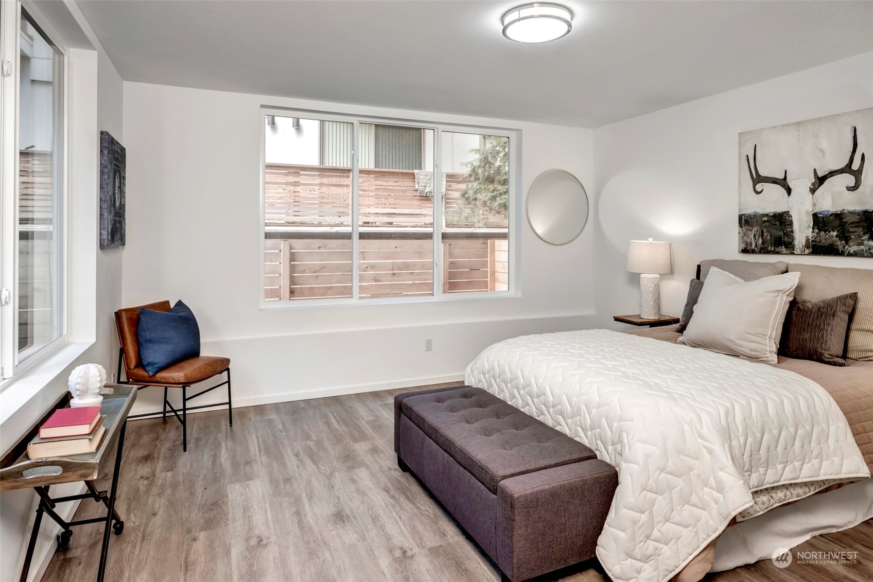 4024 Midvale Avenue North Seattle, WA 98103 - Photo 3 of 26 a bedroom with a bed and wooden floor