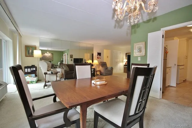 a view of a livingroom with furniture a livingroom and chandelier