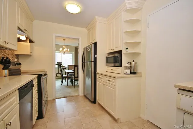 a view of a livingroom with furniture and a window