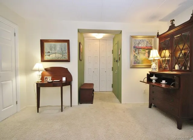 a bedroom with a bed and dresser