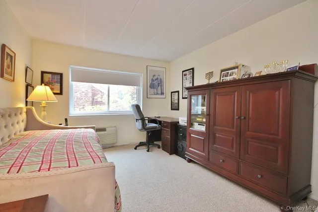 a bedroom with a bed and cabinets