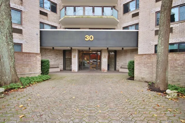 a front view of a building with yellow lighting