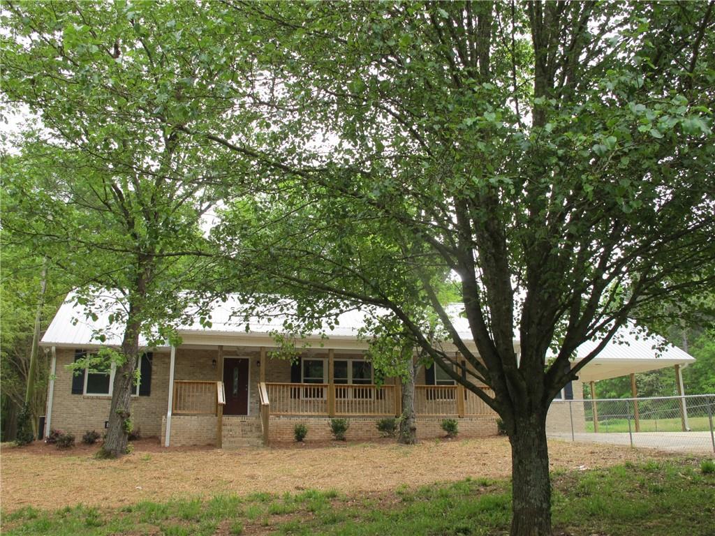 150 Reynolds Road Athens, GA 30607 - Photo 1 of 1 a front view of a house with garden