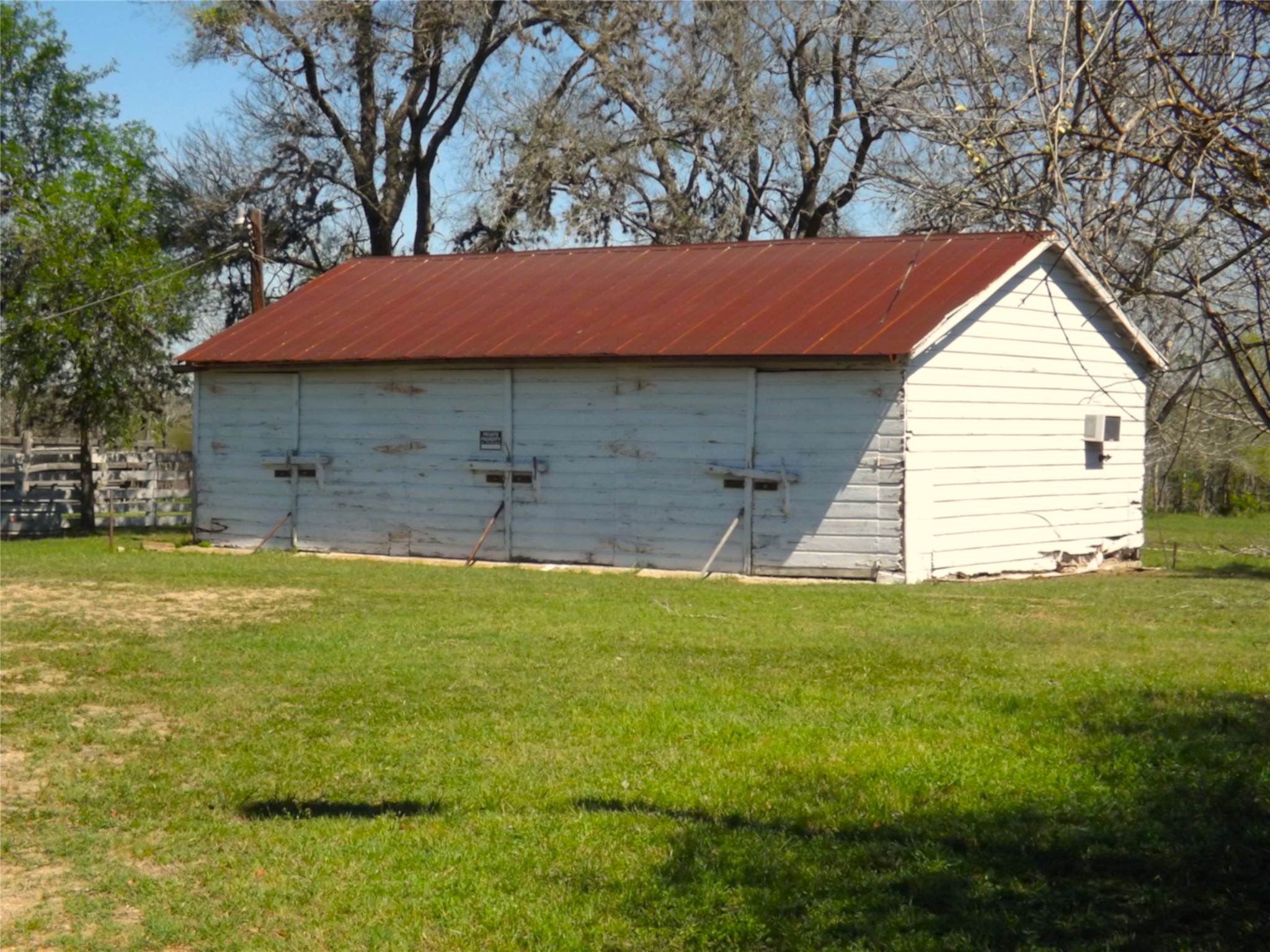1649 County Road 209 Weimar, TX 78962 - Photo 23 of 27 a view of a house with a backyard