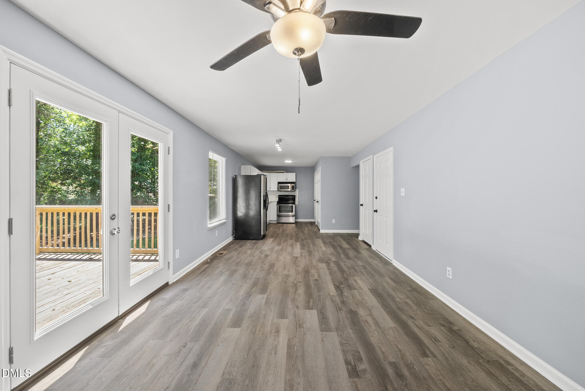 2108 Treverton Place Raleigh, NC 27609 - Photo 7 of 30 a view of empty room with wooden floor and fan