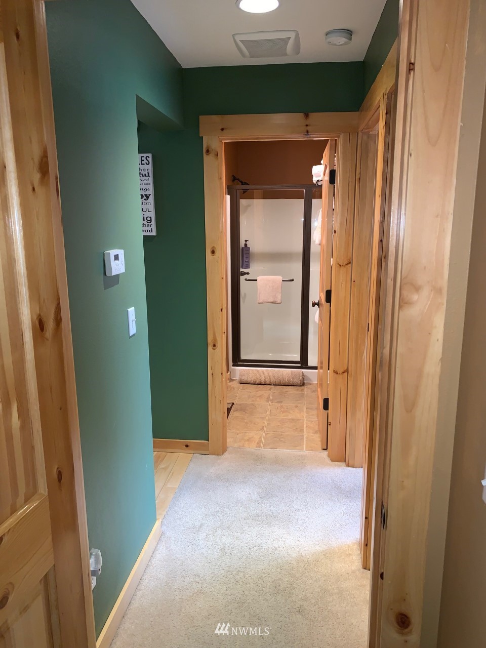 210 Clearwater Loop, Unit 2 Ronald, WA 98940 - Photo 16 of 35 an empty room with closet and wooden door