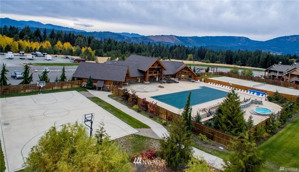 210 Clearwater Loop, Unit 2 Ronald, WA 98940 - Photo 28 of 35 a view of a swimming pool with a patio and a garden