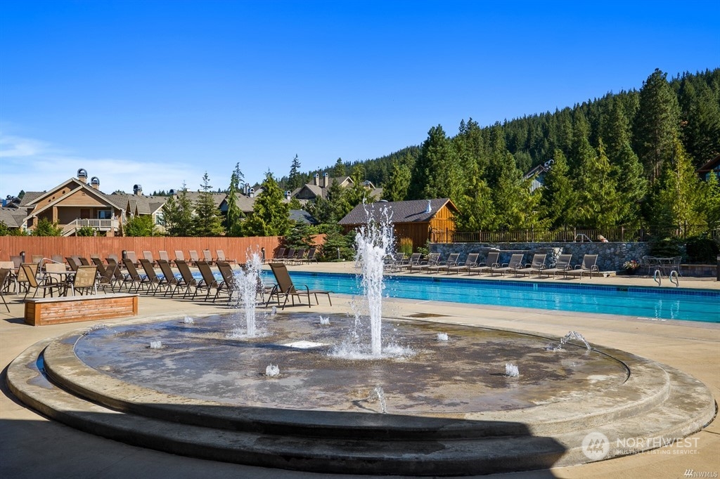 210 Clearwater Loop, Unit 2 Ronald, WA 98940 - Photo 31 of 35 a view of a swimming pool with an outdoor seating