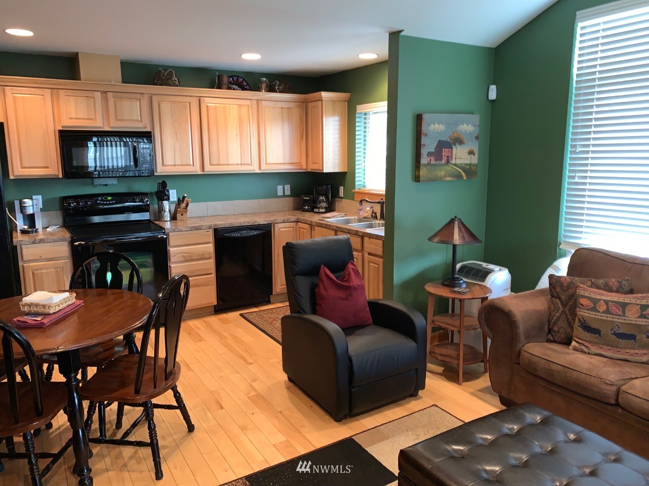 210 Clearwater Loop, Unit 2 Ronald, WA 98940 - Photo 5 of 35 a living room with furniture a flat screen tv and kitchen view