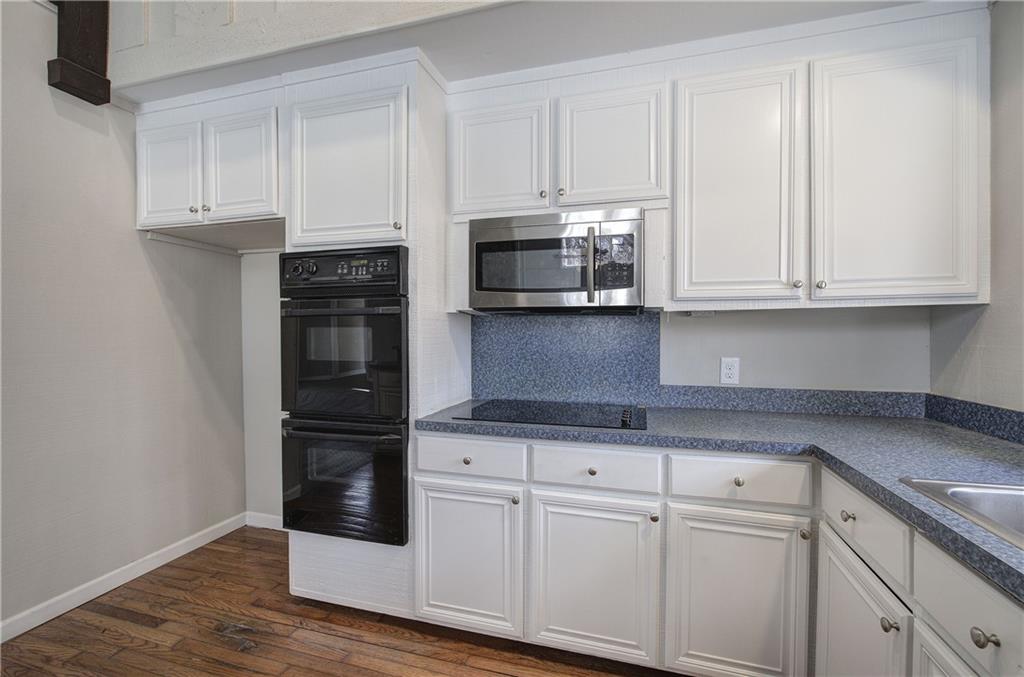 30 Tamarack Court Jasper, GA 30143 - Photo 11 of 70 a kitchen with granite countertop white cabinets and stainless steel appliances