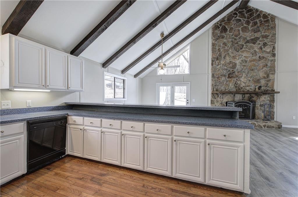 30 Tamarack Court Jasper, GA 30143 - Photo 13 of 70 a kitchen with granite countertop white cabinets and white appliances