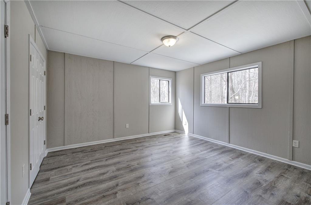 30 Tamarack Court Jasper, GA 30143 - Photo 15 of 70 an empty room with wooden floor and windows
