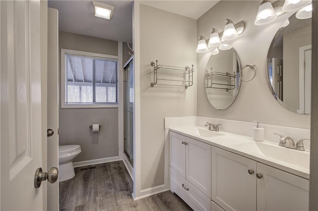 30 Tamarack Court Jasper, GA 30143 - Photo 17 of 70 a bathroom with a double vanity sink toilet and shower