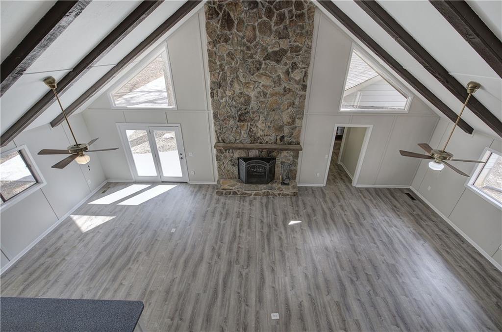 30 Tamarack Court Jasper, GA 30143 - Photo 28 of 70 a view of a livingroom with wooden floor and a fireplace