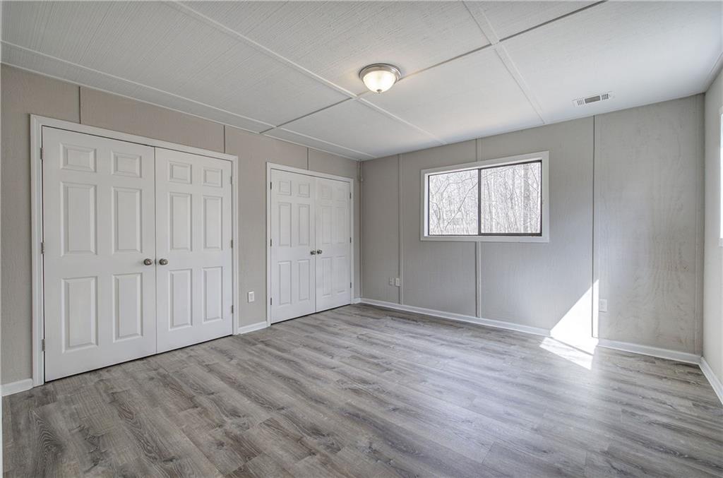 30 Tamarack Court Jasper, GA 30143 - Photo 29 of 70 an empty room with wooden floor and windows