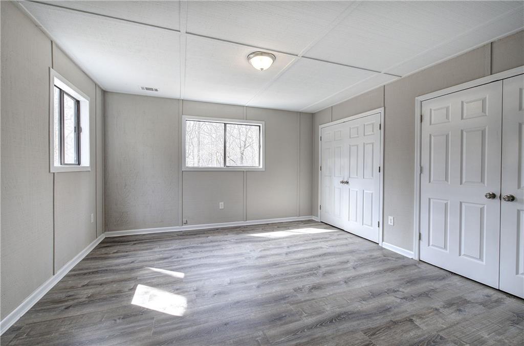 30 Tamarack Court Jasper, GA 30143 - Photo 32 of 70 an empty room with wooden floor and windows