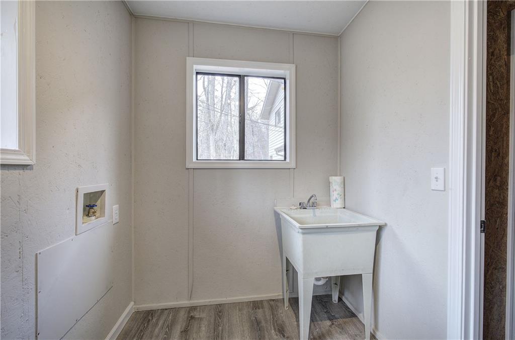 30 Tamarack Court Jasper, GA 30143 - Photo 36 of 70 a bathroom with a sink a mirror and a window