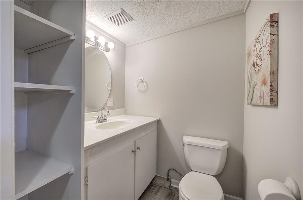 30 Tamarack Court Jasper, GA 30143 - Photo 37 of 70 a bathroom with a toilet sink and mirror