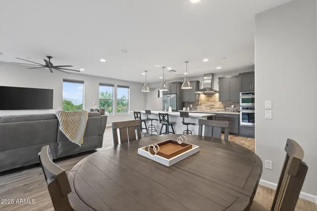 a spacious bedroom with a bed and large window