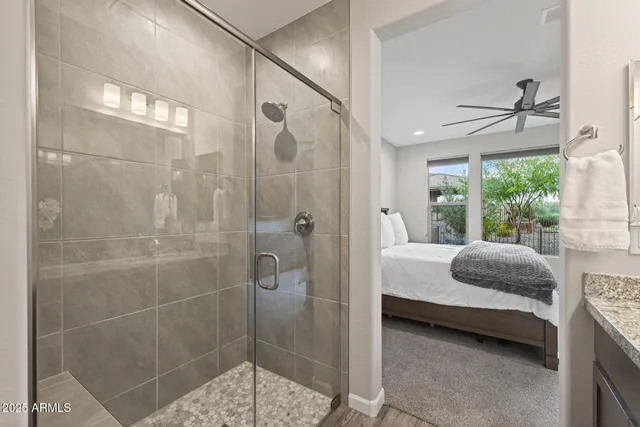 an aerial view of a house with a mountain