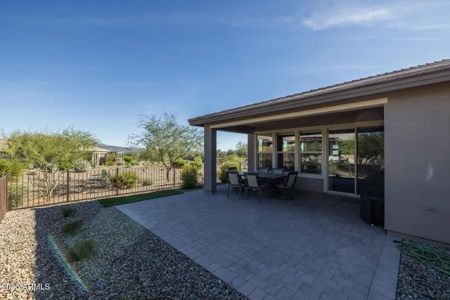 a room with lots of furniture and white walls