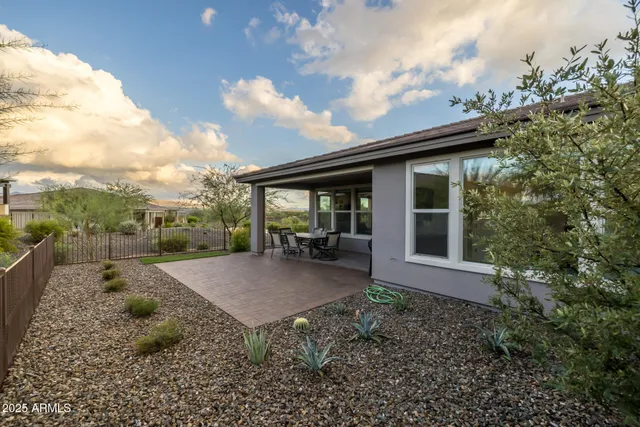 a view of swimming pool with a yard and sitting area