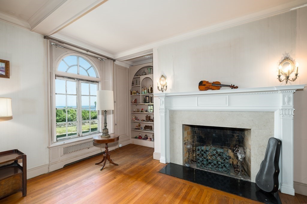 145 Atlantic Road Gloucester, MA 01930 - Photo 12 of 32 a living room with furniture and a fireplace