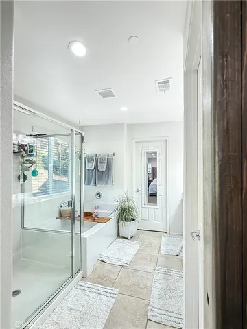 a view of a hallway with wooden floor and a livingroom view