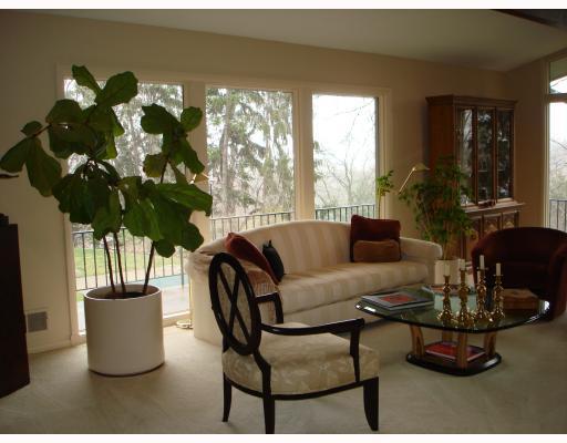 310 Buckingham Road Fox Chapel, PA 15215 - Photo 2 of 12 Living Room. Lovely living room with walls of glass overlooking the gorgeous property. Wall to wall carpeting, a peaked ceiling with beams and track lighting, a raised fireplace and a door leading to the large deck across the rear of the house.