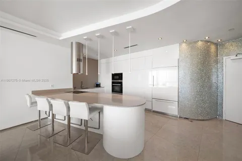 a bedroom with a large bed and a large window