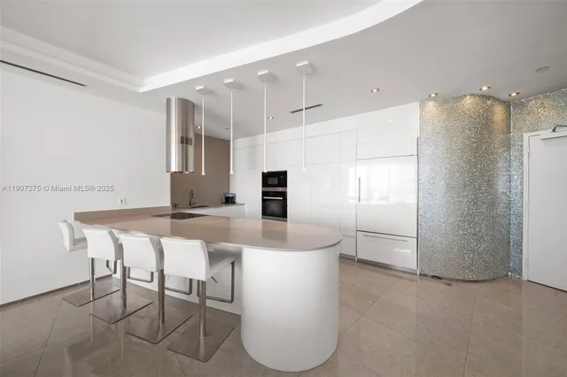 a bedroom with a large bed and a large window