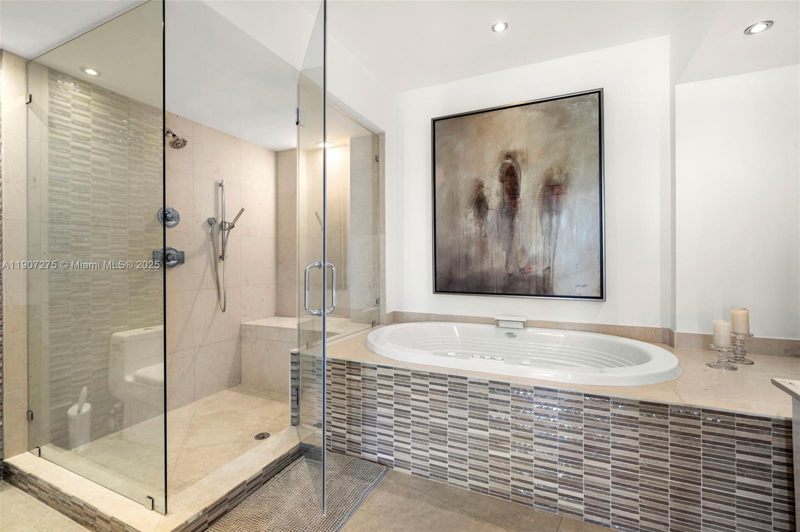 450 Alton Road, Unit PH4104 Miami Beach, FL 33139 - Photo 27 of 84 a bathroom with a bathtub and a shower