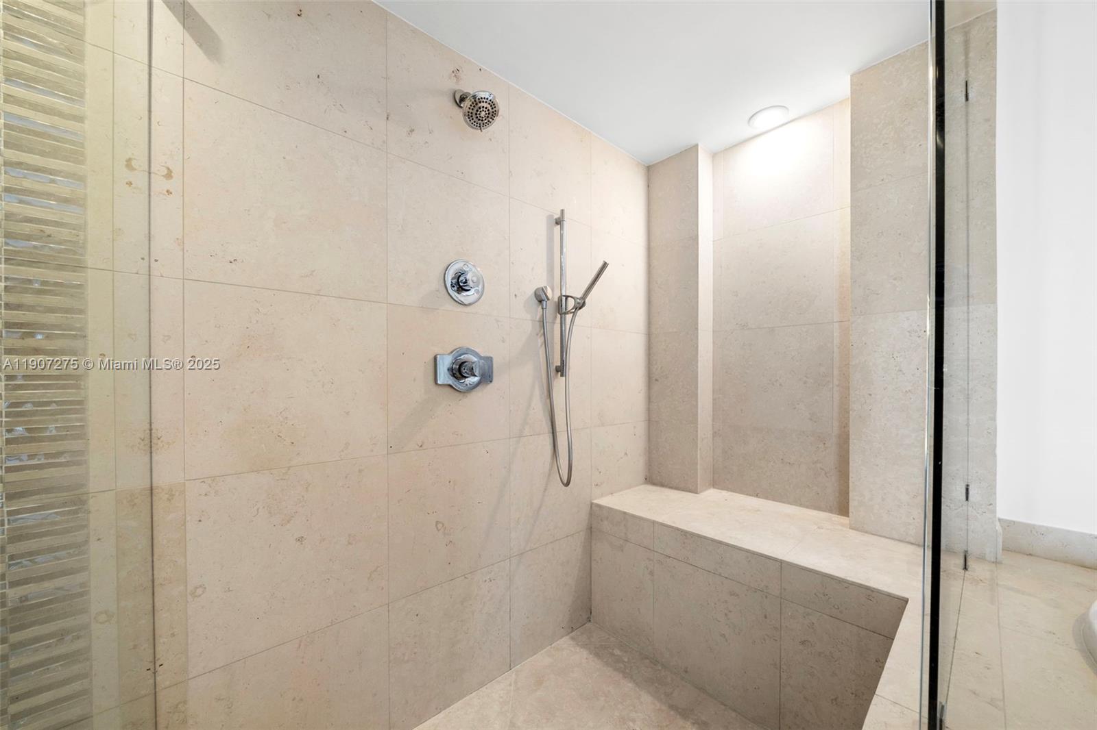 450 Alton Road, Unit PH4104 Miami Beach, FL 33139 - Photo 30 of 84 a bathroom with a shower and a toilet