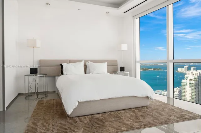 a view of washer and dryer with kitchen in the background