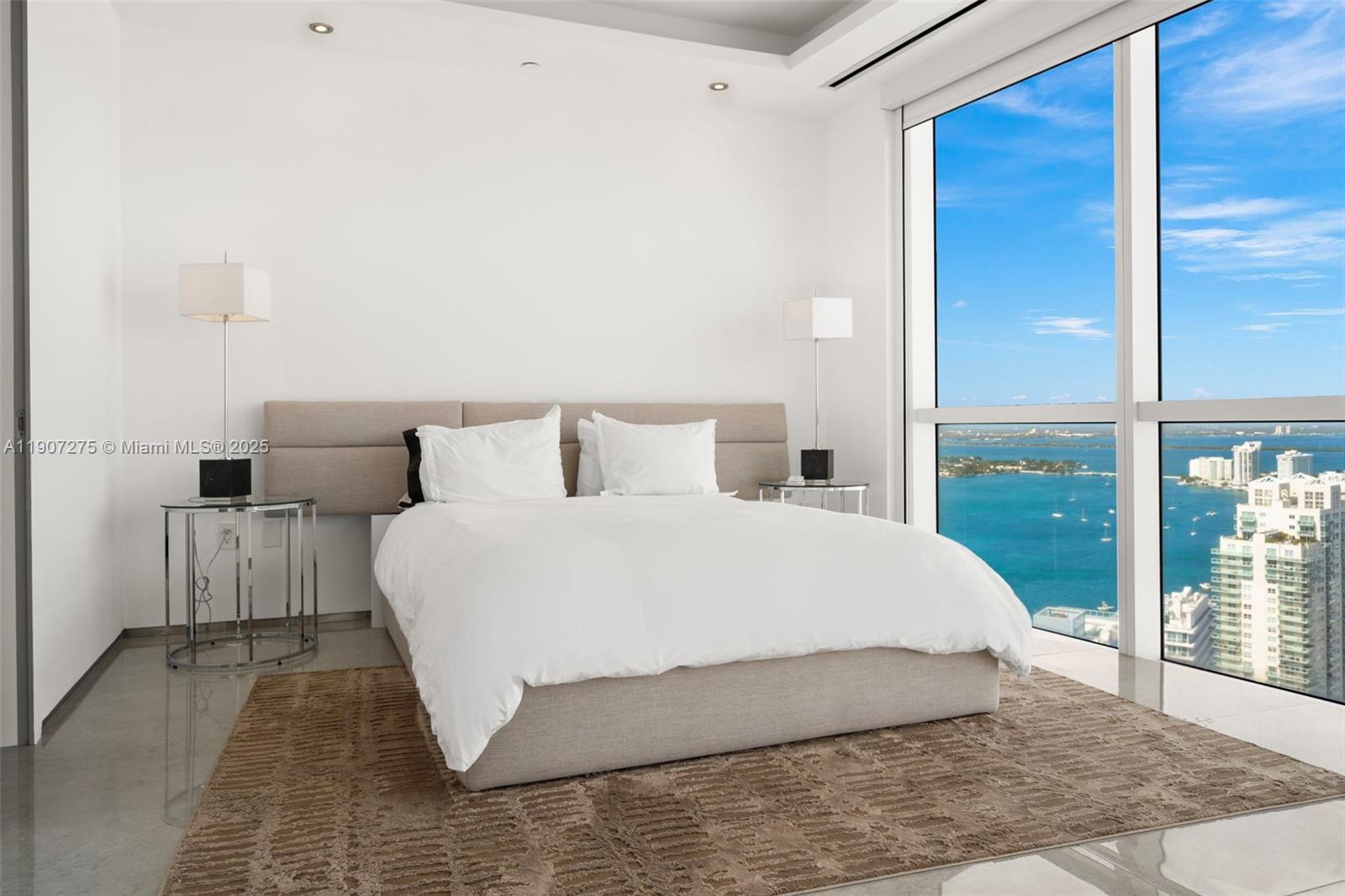 450 Alton Road, Unit PH4104 Miami Beach, FL 33139 - Photo 36 of 84 a bedroom with a bed and a large window