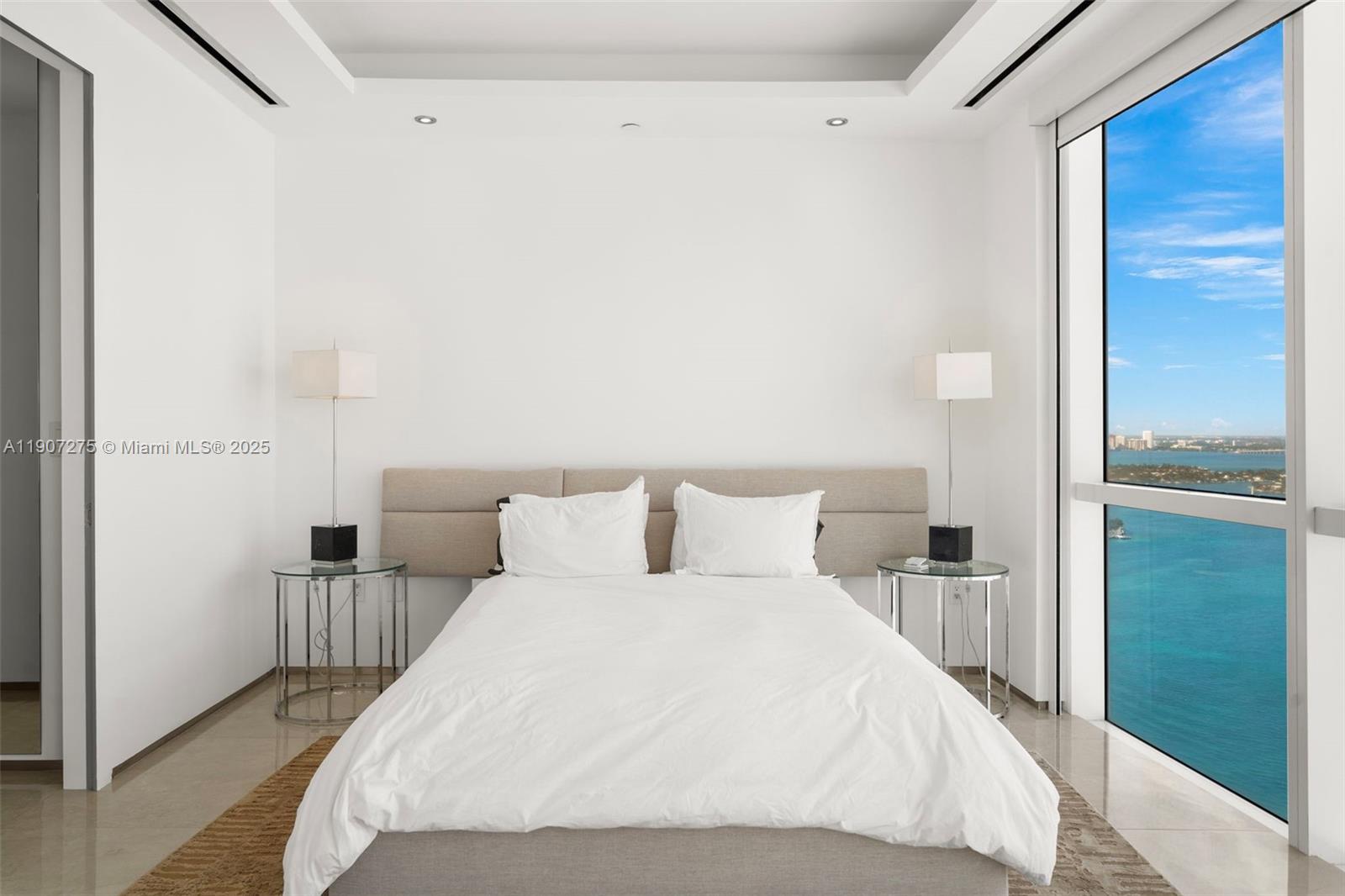 450 Alton Road, Unit PH4104 Miami Beach, FL 33139 - Photo 38 of 84 a large bed in a white room