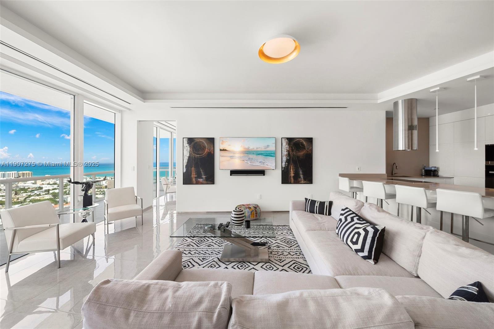 450 Alton Road, Unit PH4104 Miami Beach, FL 33139 - Photo 6 of 84 a view of living room with furniture and a large window