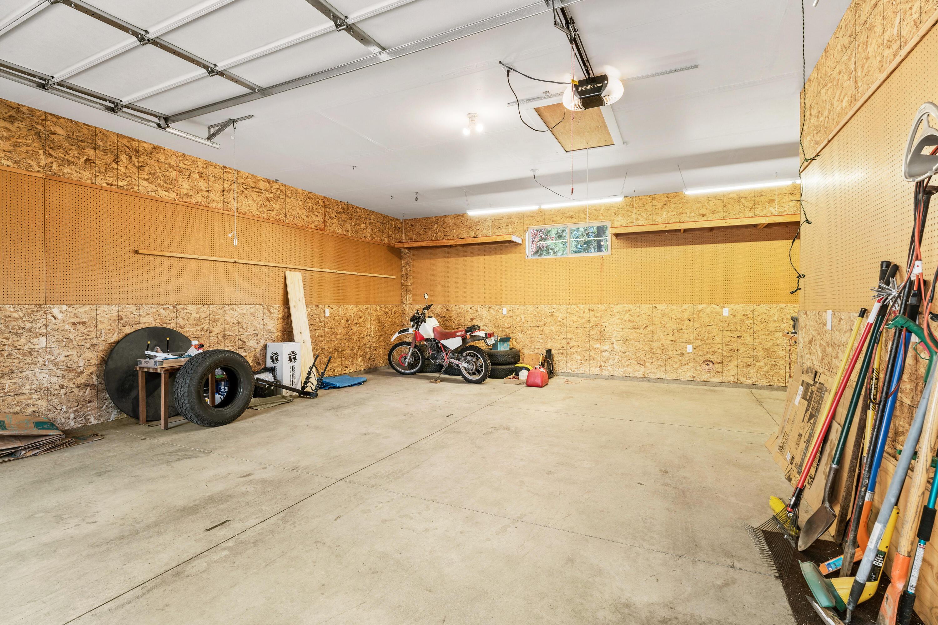 19031 Baker Road Bend, OR 97702 - Photo 24 of 35 a view of a garage with parked cars