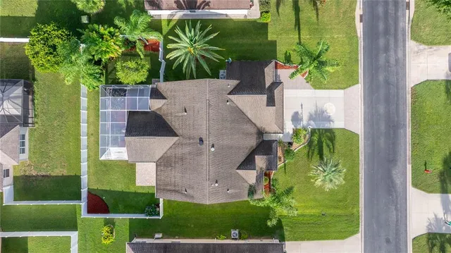 an aerial view of a house with a garden and plants