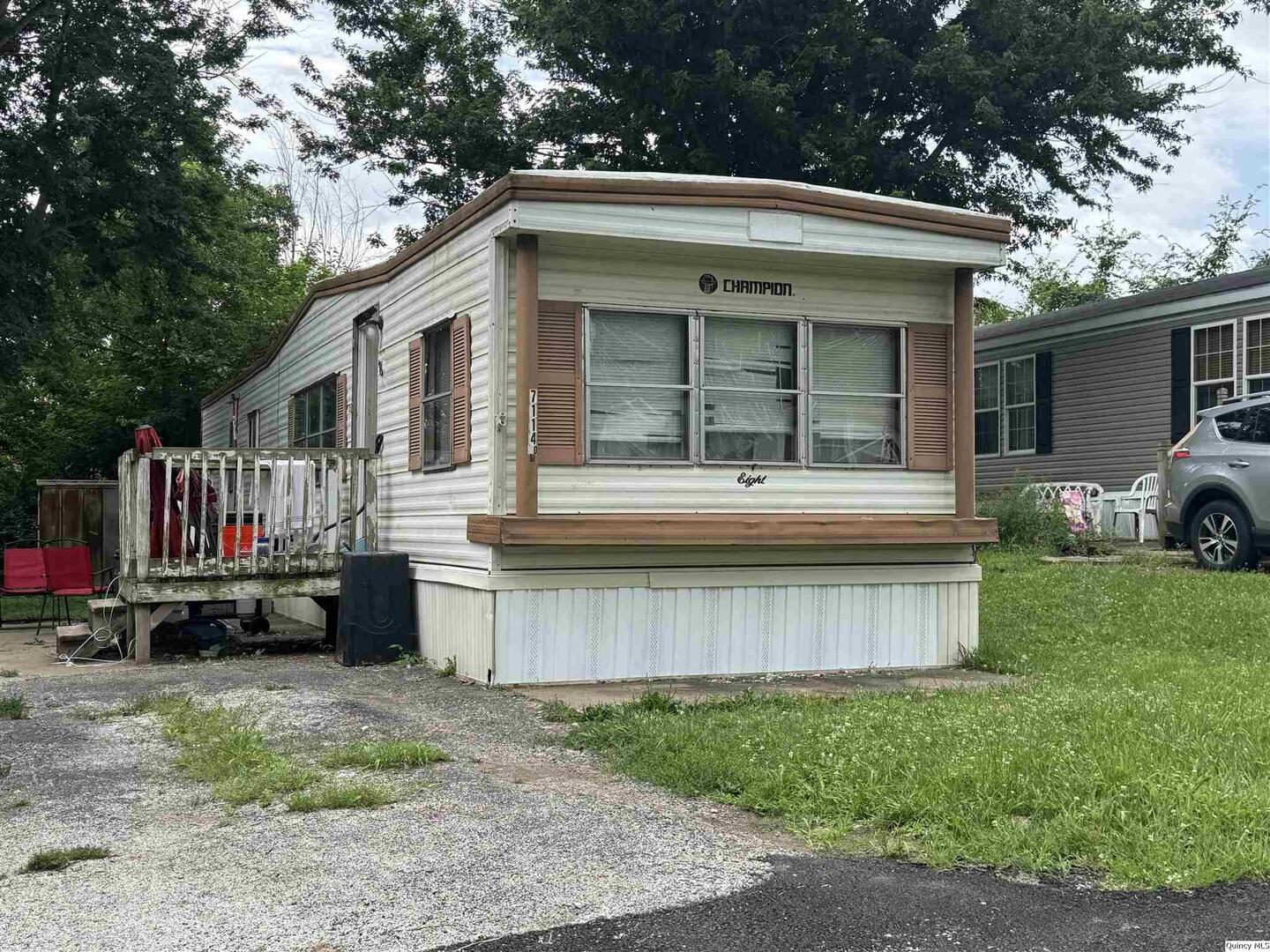 7114 Timber Ridge South Quincy, IL 62305 - Photo 1 of 9 a view of a house with a yard and roof