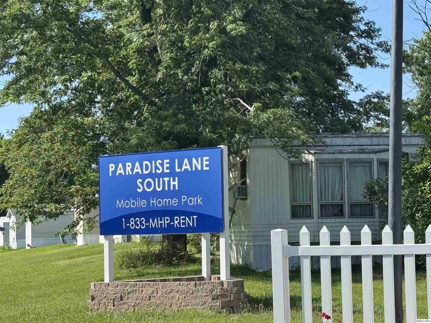 7114 Timber Ridge South Quincy, IL 62305 - Photo 2 of 9 a sign on the side of the house