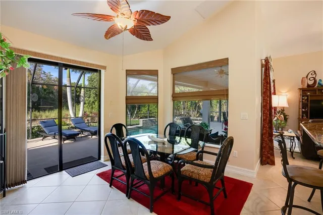 a kitchen with kitchen island stainless steel appliances a sink and a chandelier