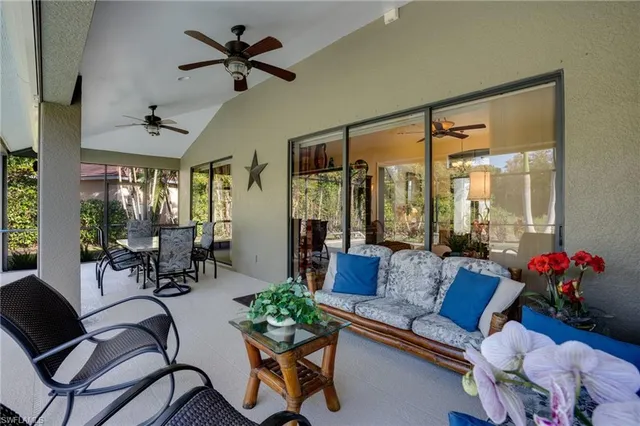 a backyard of a house with yard and outdoor seating
