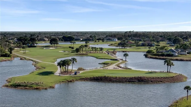 an aerial view of a swimming pool with an outdoor seating and yard